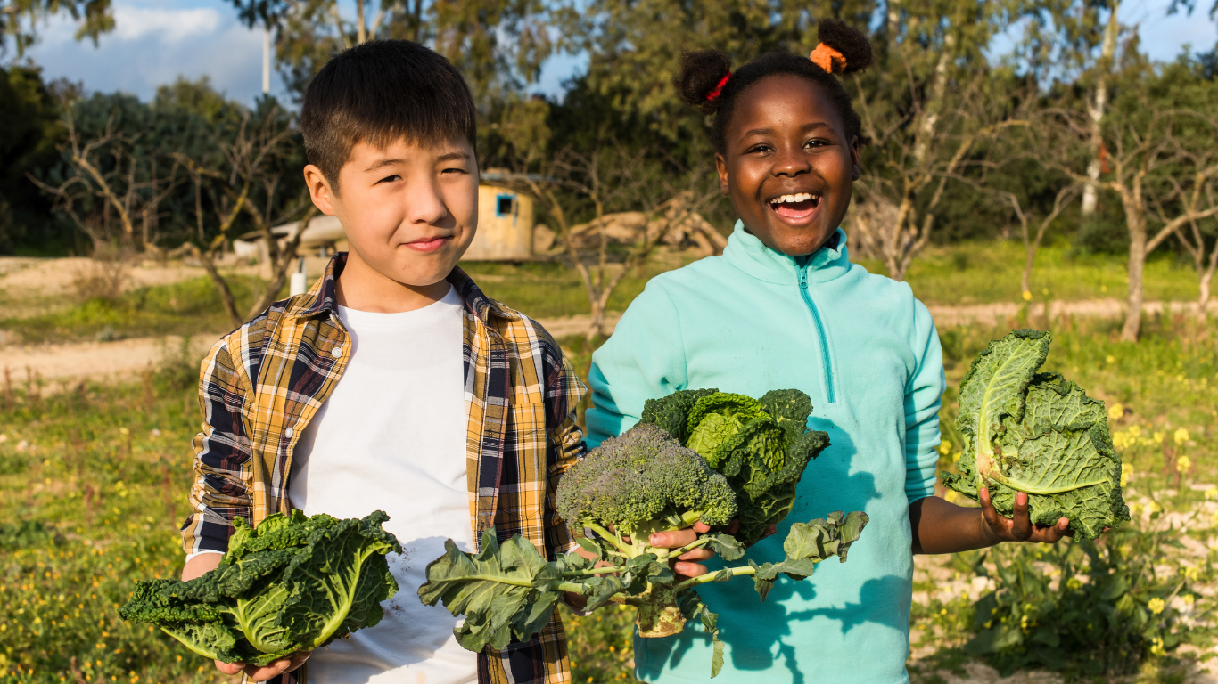 Children holding vegetables